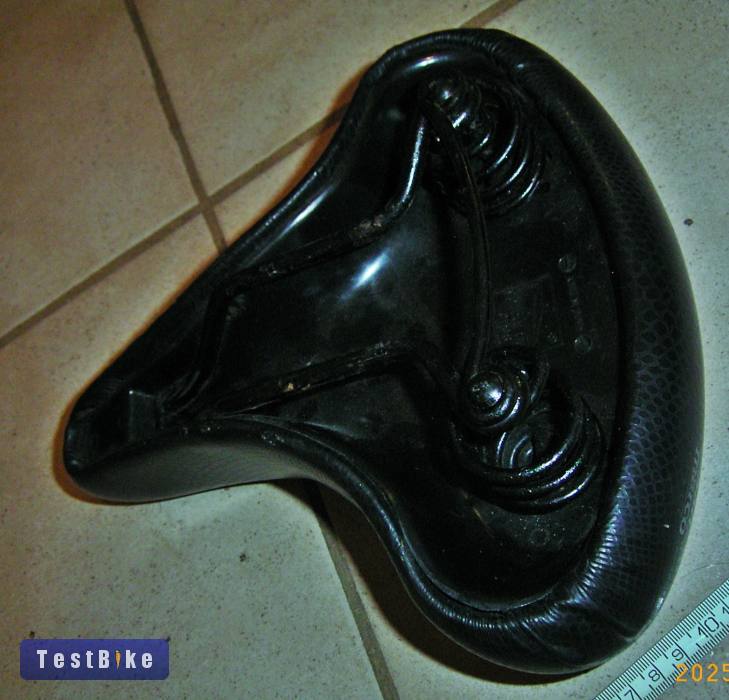 Eladó egy hátul széles, elől keskeny rugós kerékpár nyereg, 